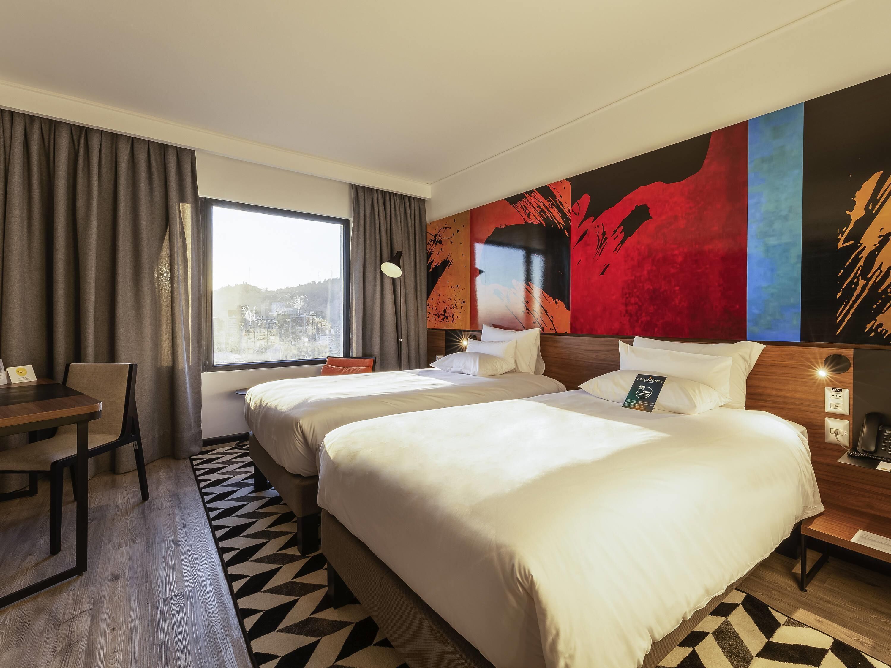 Superior Twin Room | Minibar, in-room safe, desk, laptop workspace
