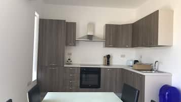 Comfort Apartment | Private kitchen | Full-sized fridge, oven, dishwasher, coffee/tea maker