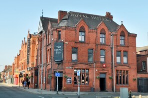 A red brick building with a sign for "The Corner Bar" and "Royal Hotel." - The Royal Hotel Crewe, A BRILLIANT Collection (Crewe)