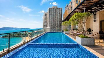 2 outdoor pools, pool umbrellas, pool loungers