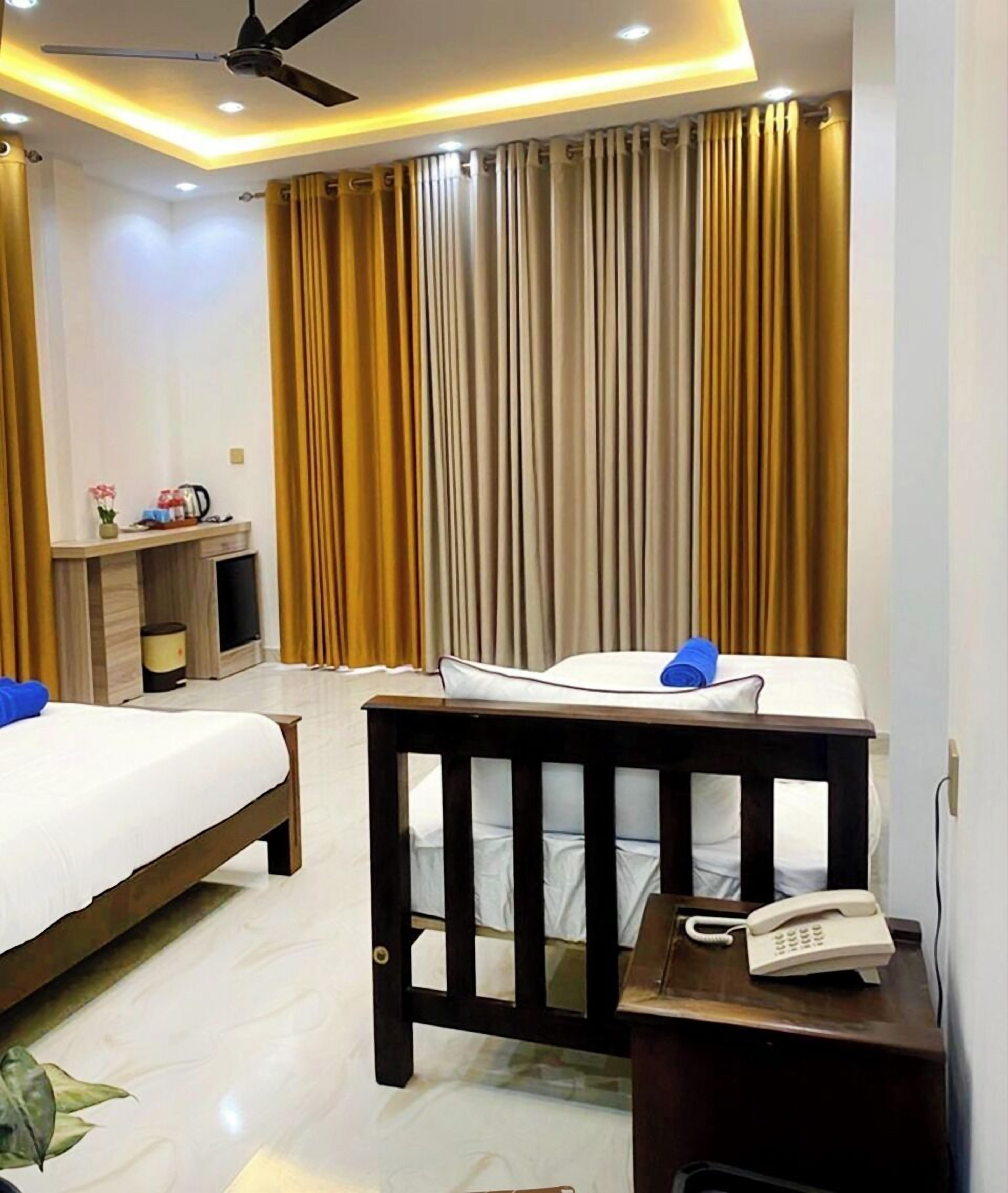 Habitación triple Premier | Sábanas de algodón egipcio y ropa de cama de alta calidad