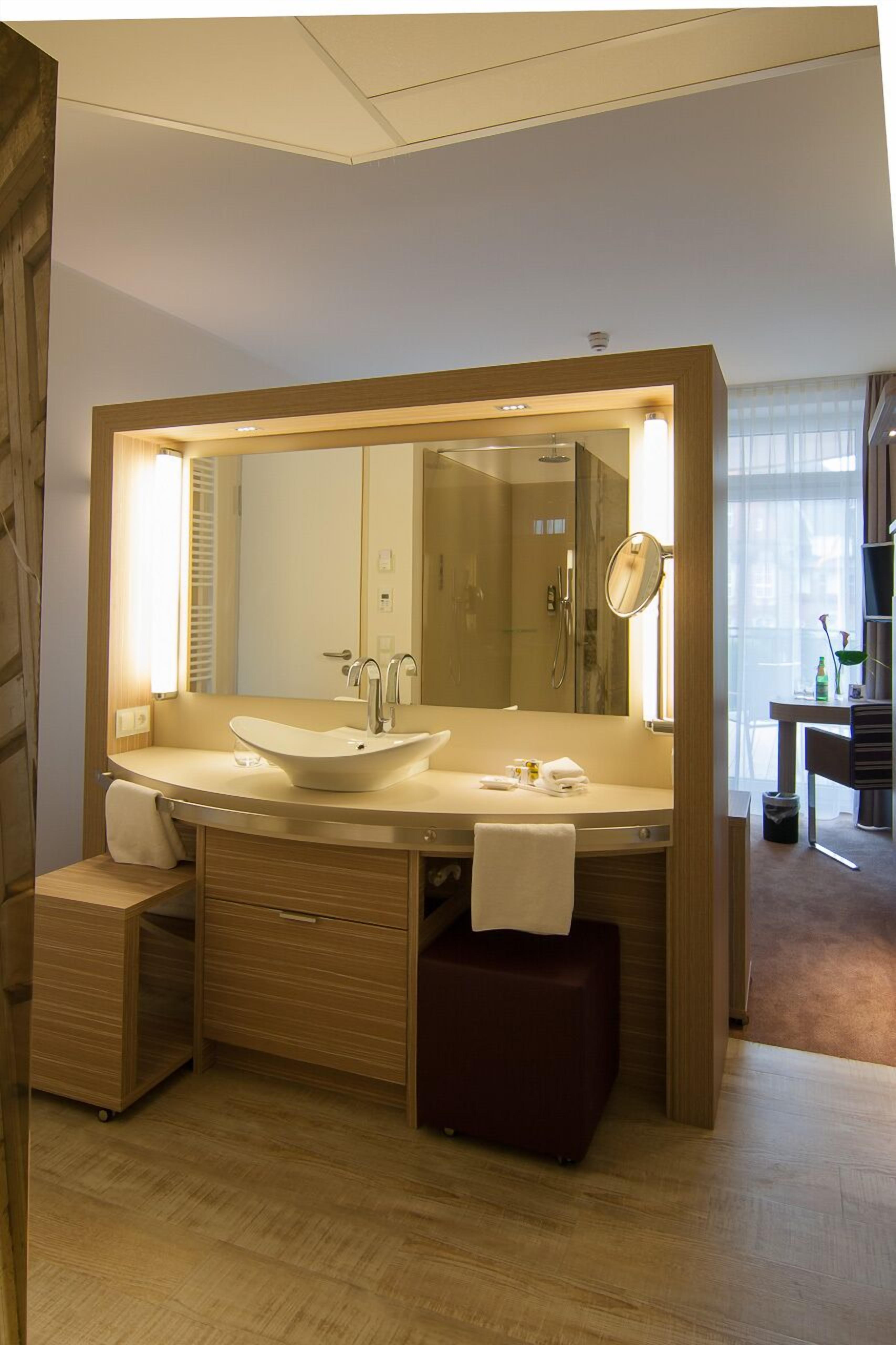 standard double room | bathroom | shower, rainfall showerhead, hair dryer, towels