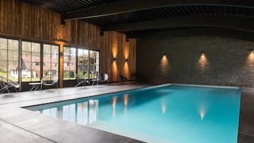 Relax by the tranquil pool with a serene view of the surrounding landscape.
