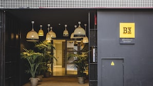 A hotel entrance with a sign reading "B3" and "BARBARAUX".