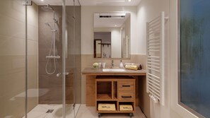 Ducha, artículos de tocador gratuitos, pantuflas, toallas