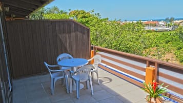 Suíte Família com Terraço | Frigobar, cortinas blackout, Wi-Fi de cortesia, roupa de cama