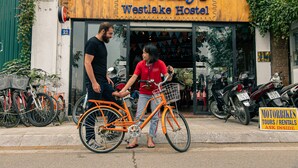 A storefront with a sign reading "Fridays Westlake Hostel".