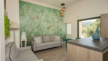 Villa | Living area | 28-inch flat-screen TV with satellite channels, TV