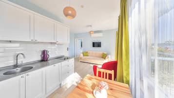 Family Suite, 1 Queen Bed with Sofa bed, Balcony, Garden View | 1 bedroom, Egyptian cotton sheets, premium bedding, desk