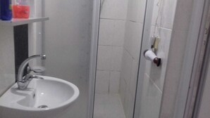 A small bathroom with a white sink, a mirror, and a towel rack. - Abant Hayalim Pansiyon (Bolu)