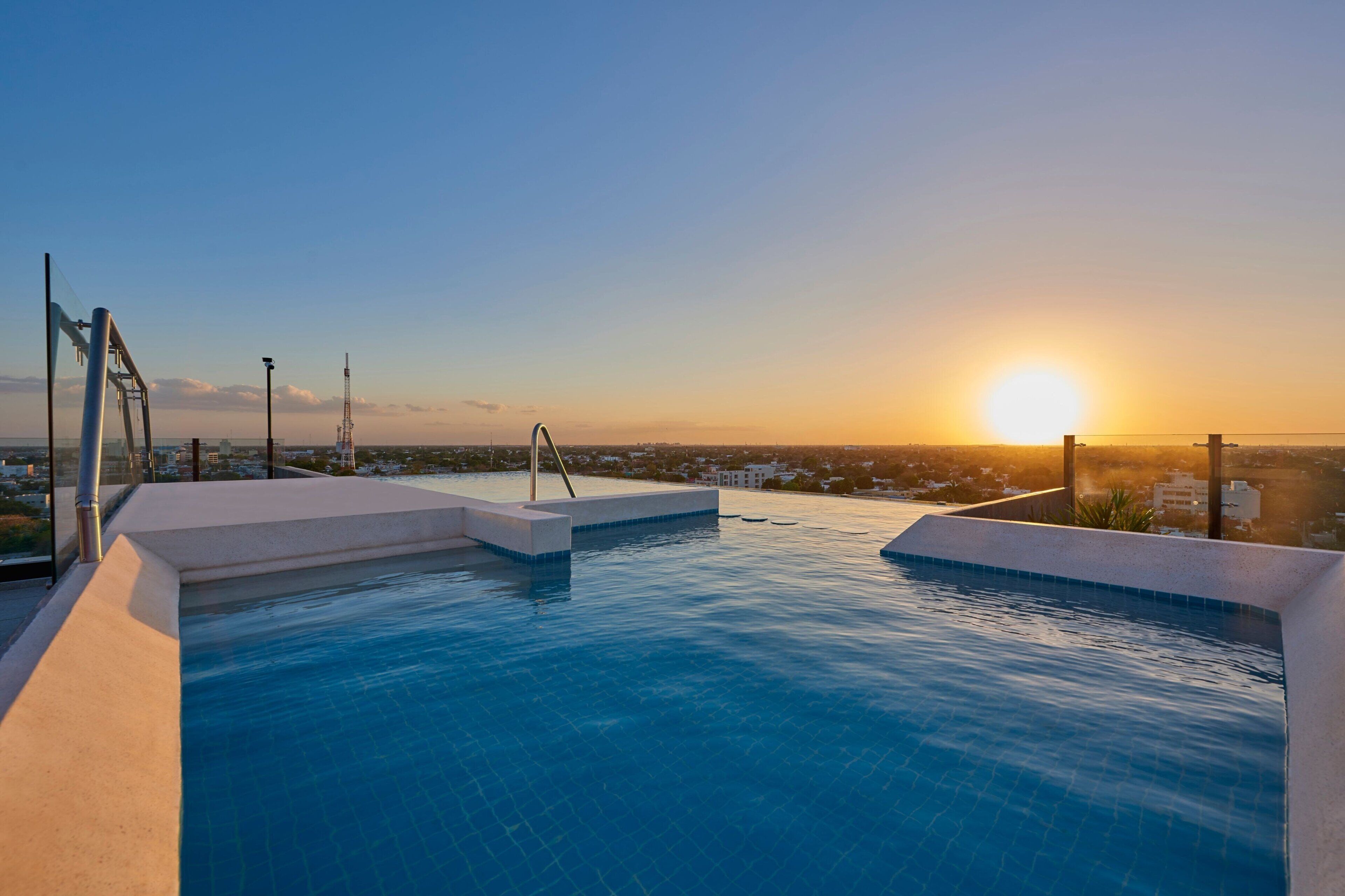 outdoor pool, open 8:00 am to 8:00 pm, pool umbrellas, pool loungers