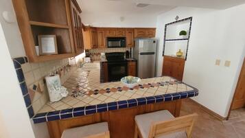 Family Villa, Multiple Beds, Non Smoking | Private kitchen | Full-sized fridge, microwave, oven, stovetop