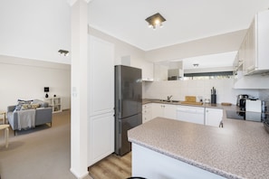 Comfort Apartment, 2 Bedrooms | Private kitchen | Full-size fridge, microwave, oven, stovetop