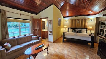 Comfort Cabin, 1 King Bed with Sofa bed, Kitchenette, Poolside | Living area | 42-inch Smart TV with digital channels, Netflix, streaming services