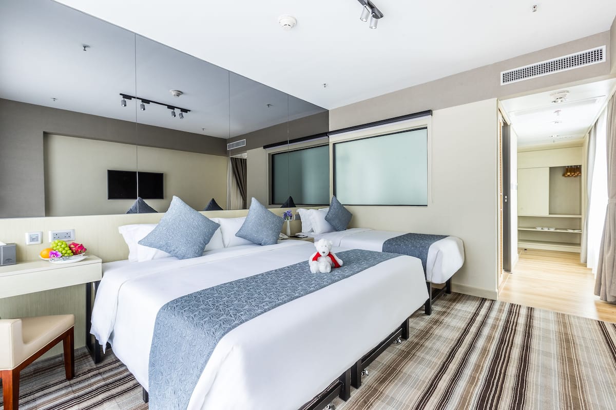 Family Triple Room | Minibar, in-room safe, blackout drapes, iron/ironing board