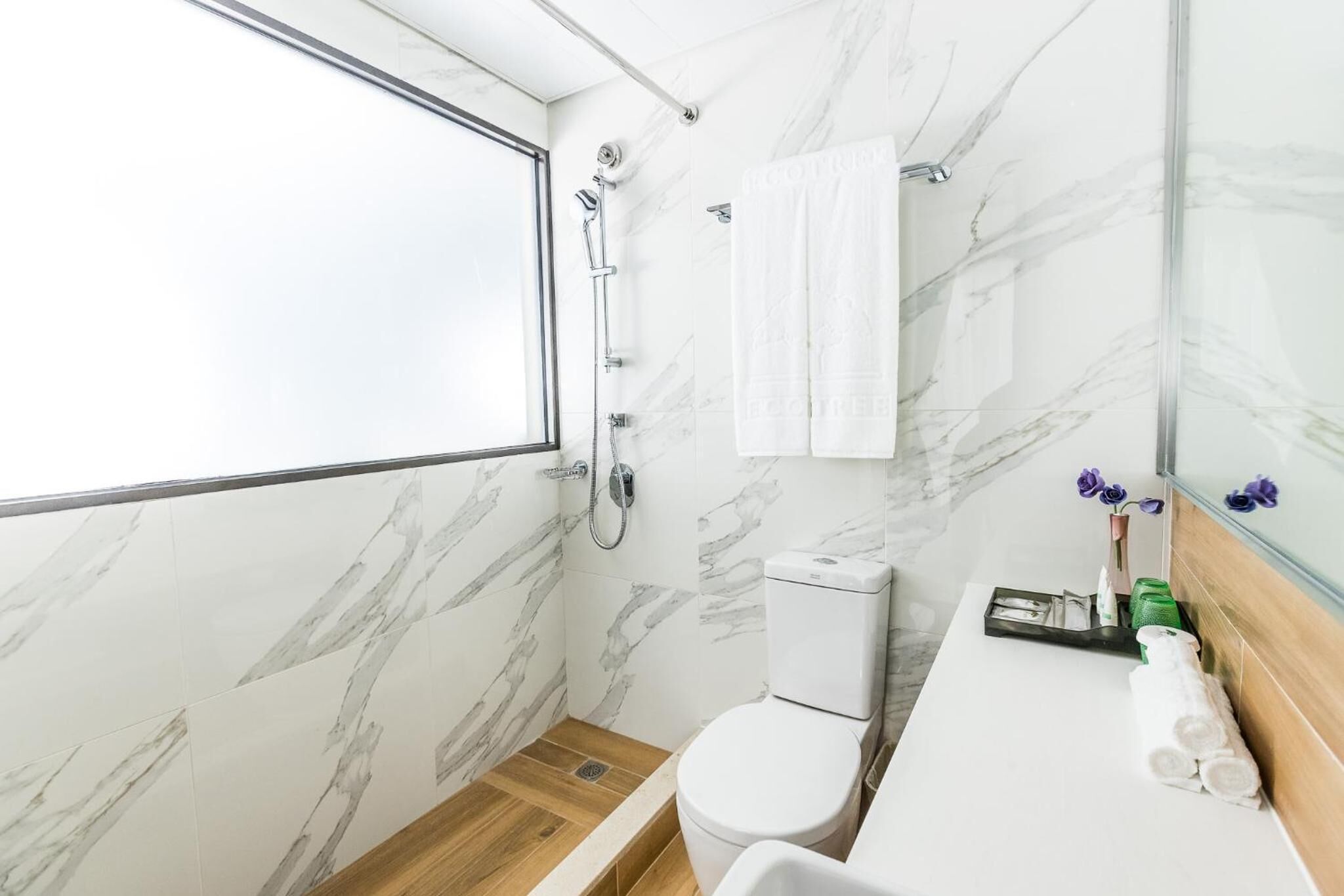 shower, free toiletries, slippers, towels