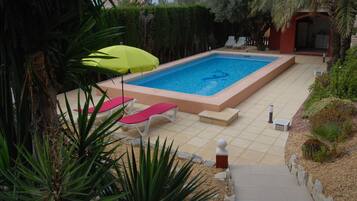 Seasonal outdoor pool, pool umbrellas, pool loungers