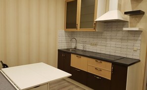 Apartment | Private kitchenette | Fridge, stovetop, electric kettle, cookware/dishes/utensils