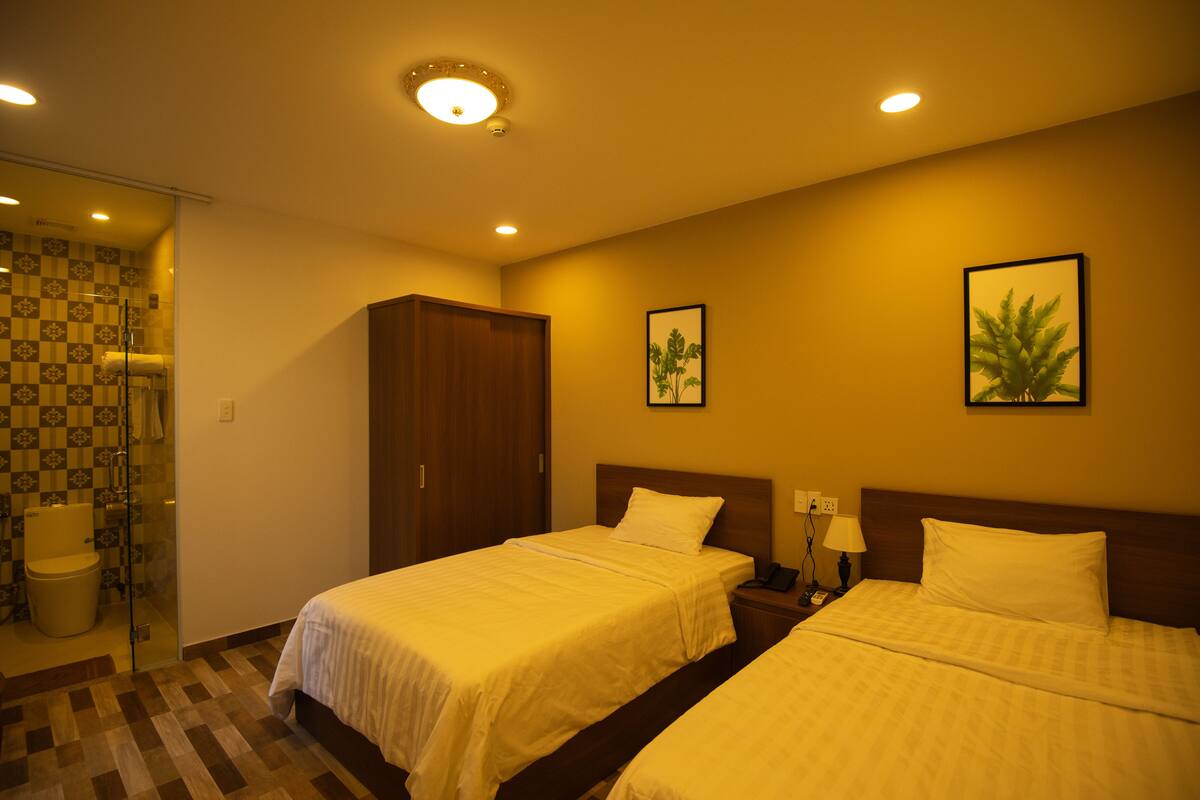 Habitación Deluxe, 2 camas individuales, para no fumadores | Artículos del minibar gratis, cortinas blackout y wifi gratis