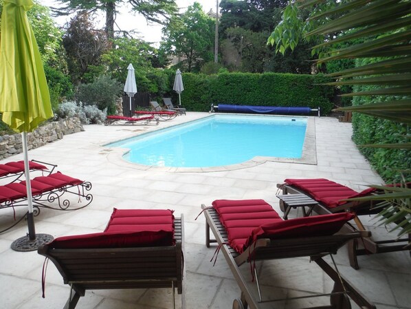 Seasonal outdoor pool, open 8:00 AM to 7:30 PM, pool umbrellas