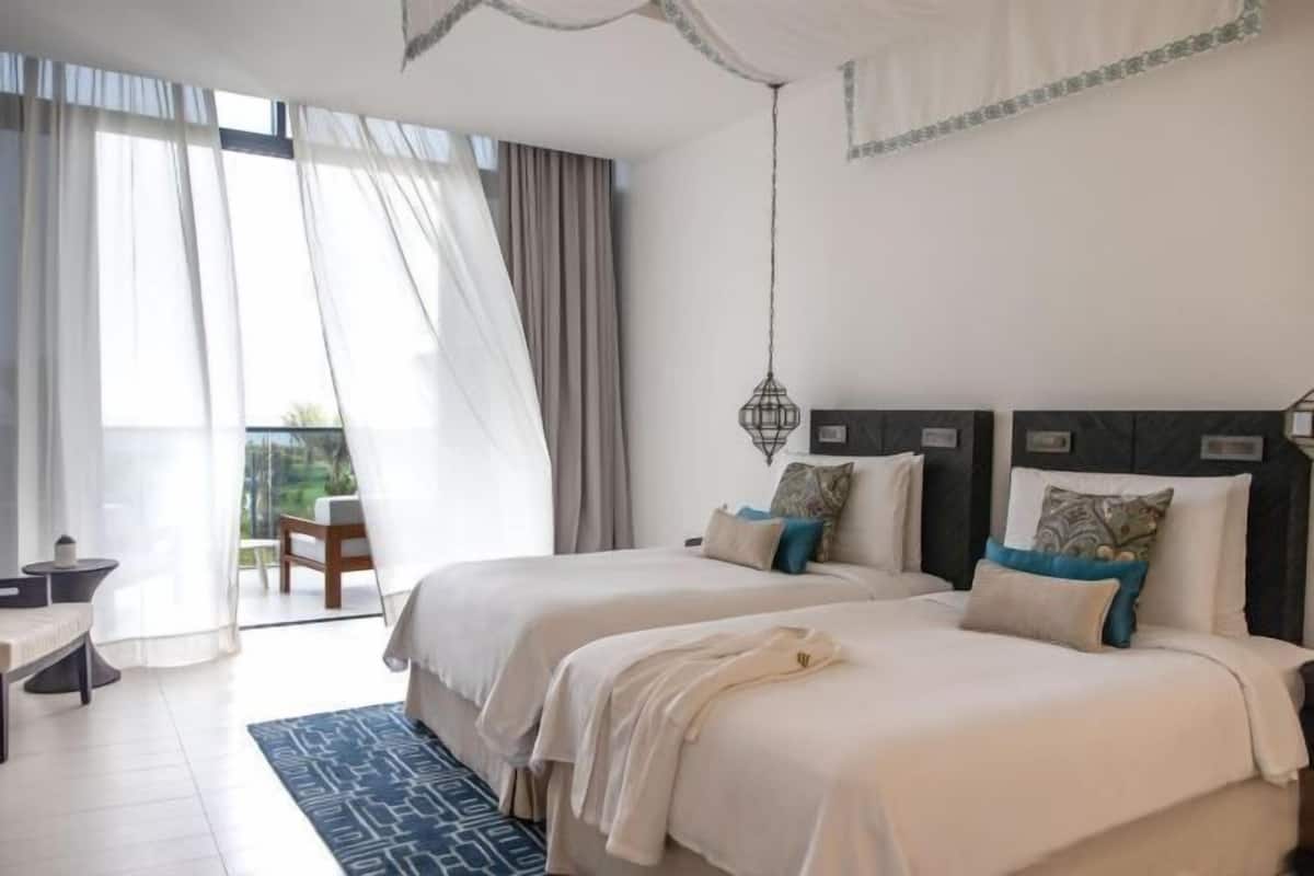 Premium bedding, down comforters, pillowtop beds, minibar