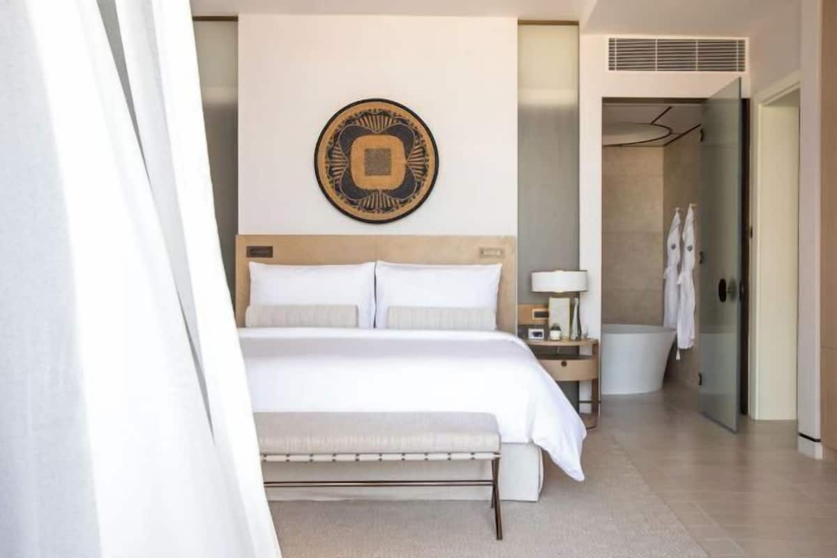 Premium bedding, down comforters, pillowtop beds, minibar