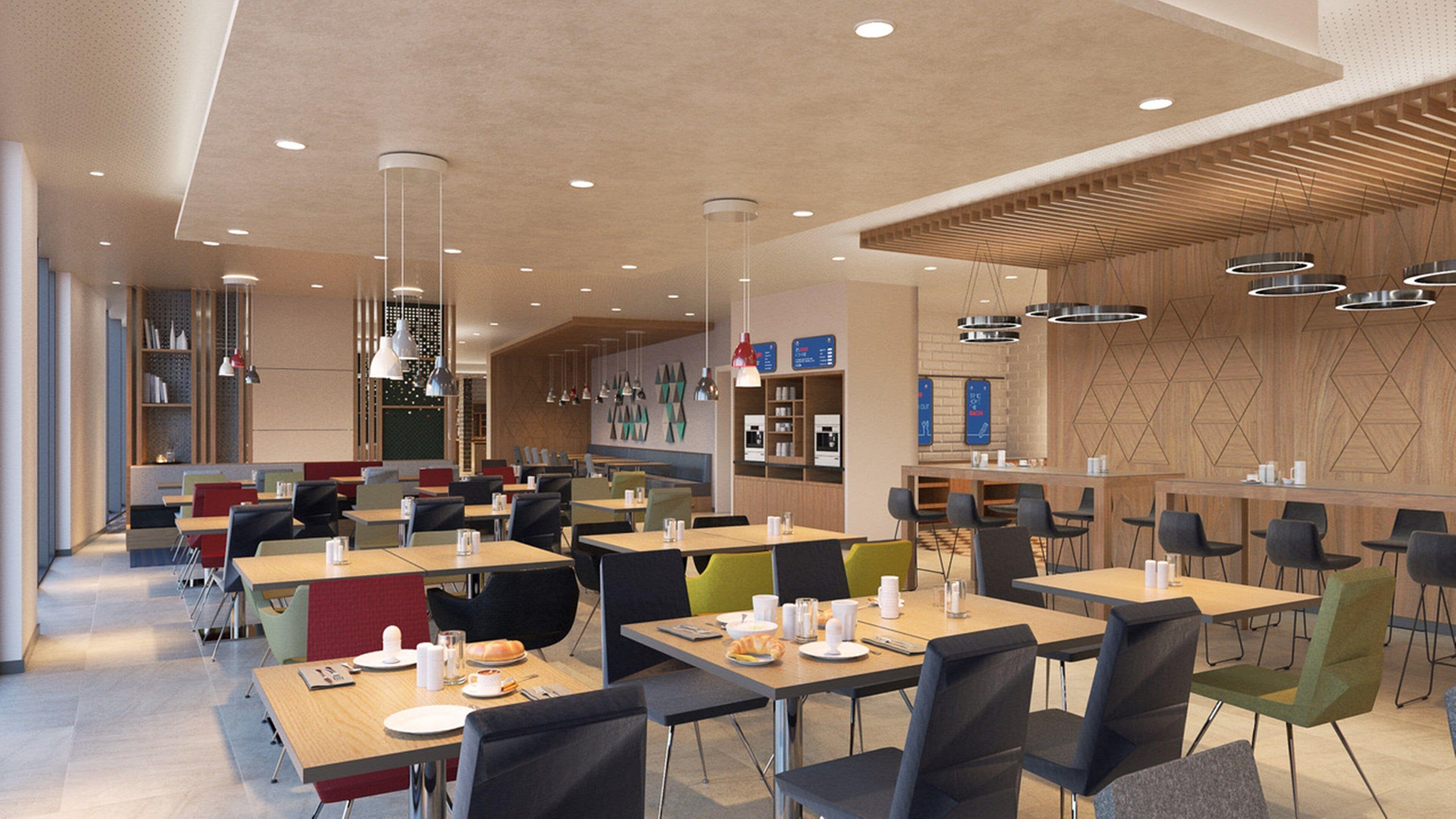 A modern restaurant with multiple dining areas, including a bar and seating with tables and chairs.