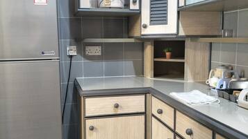 Apartment, 2 Bedrooms | Private kitchen | Full-sized fridge, stovetop, cookware/dishes/utensils