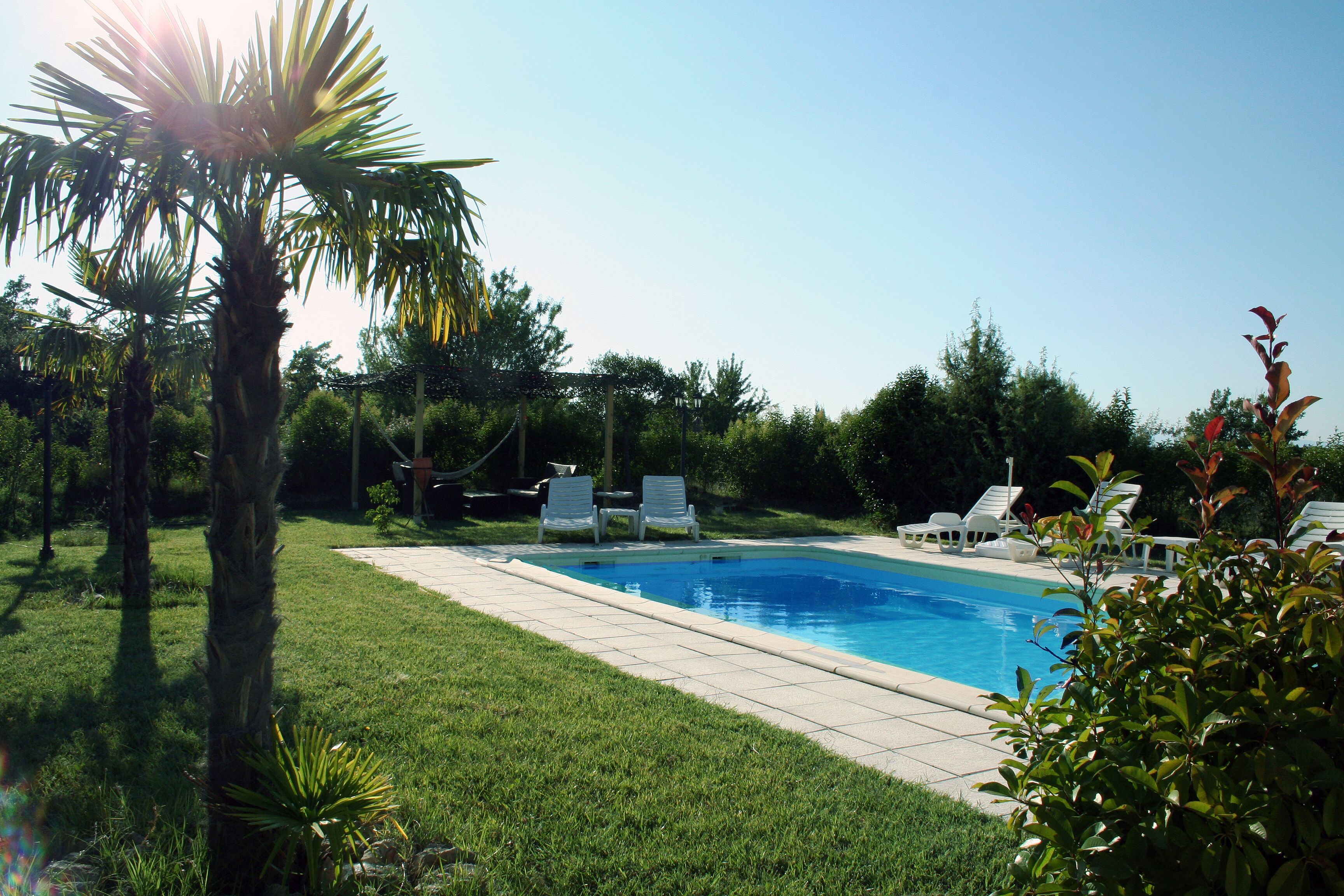 Seasonal outdoor pool, pool umbrellas, pool loungers