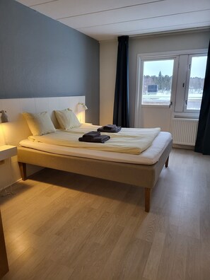 Desk, laptop workspace, blackout curtains, free WiFi