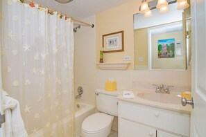 Deluxe Condo, Patio, Sea View | Bathroom | Combined shower/tub, hair dryer, towels