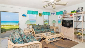 Deluxe Condo, Patio, Sea View | Living room | Flat-screen TV, DVD player