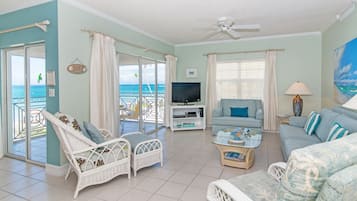 Deluxe Condo, Patio, Sea View | Living area | Flat-screen TV, DVD player