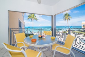 Deluxe Condo, Patio, Sea View | Terrace/patio - Regal Beach Club #122 by Cayman Vacation (Seven Mile Beach)