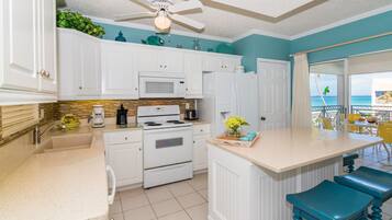 Deluxe Condo, Patio, Sea View | Private kitchen | Fridge, microwave, oven, stovetop