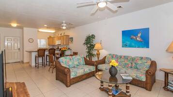 Deluxe Condo, Patio, Sea View | Living room | Flat-screen TV, DVD player