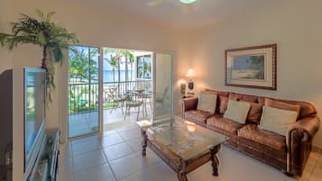 Deluxe Condo, Patio, Sea View | Living area | Flat-screen TV, DVD player