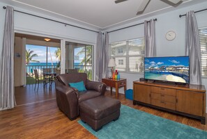 Deluxe Condo, Patio, Sea View | Living room | Flat-screen TV, DVD player
