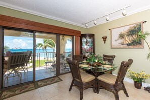 Deluxe Condo, Patio, Sea View | In-room dining - Georgetown Villas #203 by Cayman Vacation (Seven Mile Beach)