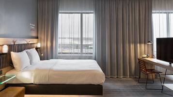 Desk, blackout drapes, soundproofing, free cribs/infant beds