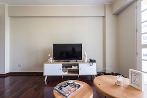Business Apartment, Multiple Beds, Non Smoking | Living area | 32-inch LCD TV with cable channels, TV