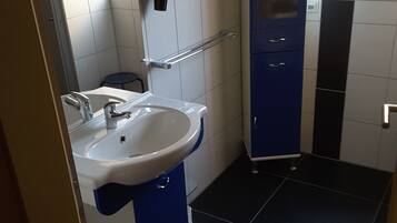 Family Apartment, 2 Bedrooms | Bathroom | Shower, hair dryer, slippers, towels