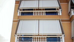 A multi-story building with balconies and large windows. - Hotel Borova (Korçë)