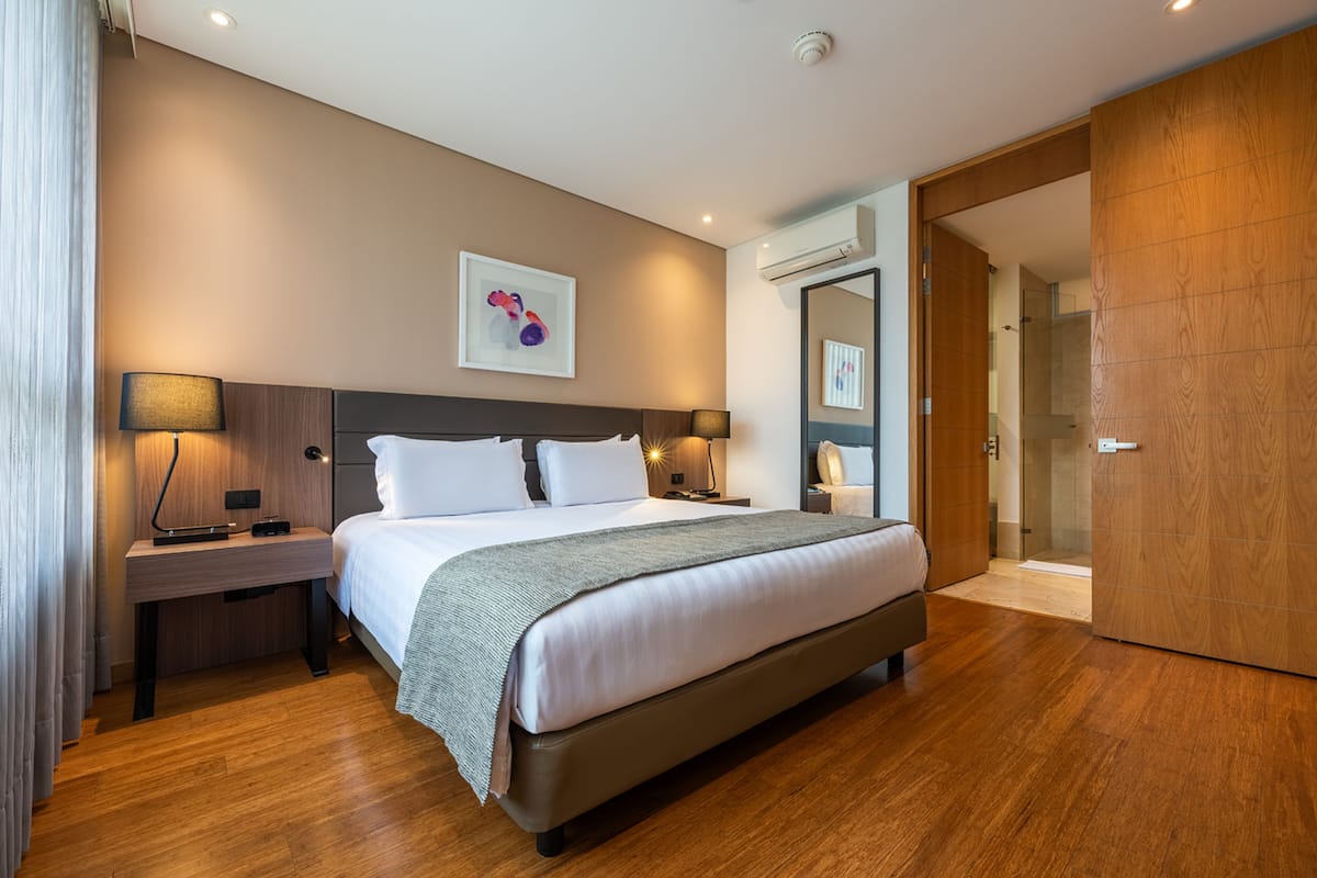 deluxe room, multiple beds | premium bedding, in-room safe, desk, laptop workspace