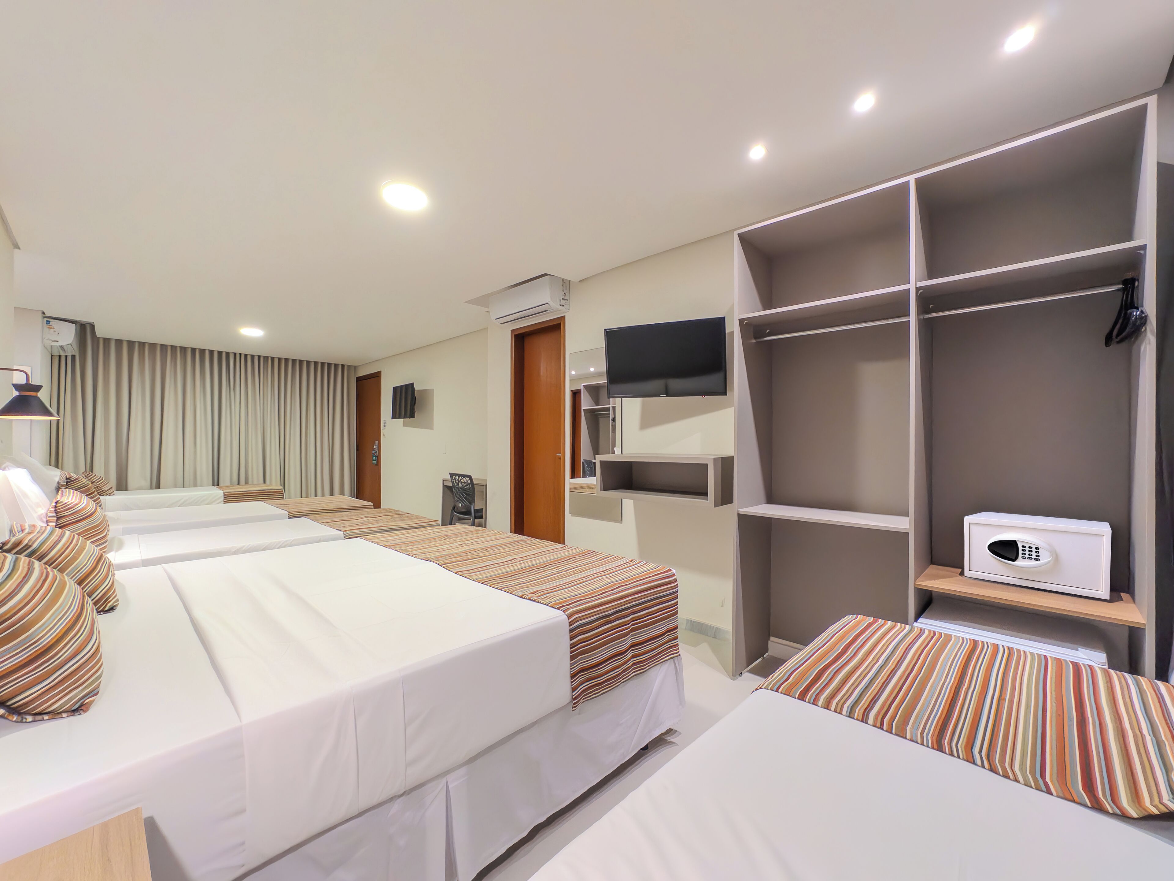 Family Room | Minibar, in-room safe, blackout curtains, free WiFi
