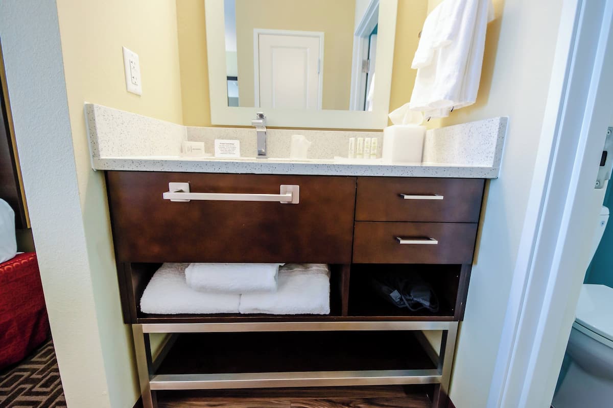 studio, 2 queen beds | bathroom | free toiletries, hair dryer