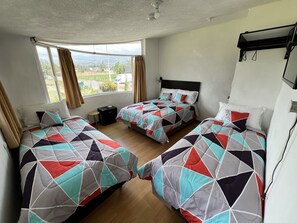 Family Quadruple Room, 2 Bedrooms, Courtyard View | Individually decorated, blackout drapes, soundproofing - Springhills Quito Airport (Tababela)