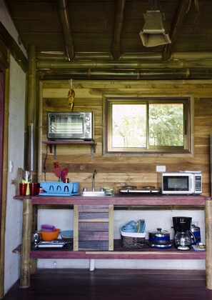 Full-size fridge, microwave, stovetop, coffee/tea maker