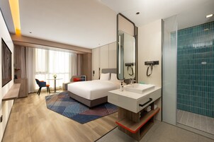 1 King Standard Extra Floor Space | Premium bedding, down comforters, laptop workspace, blackout drapes