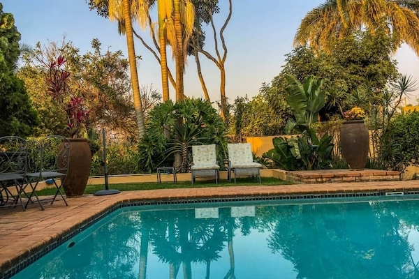 Outdoor pool, pool umbrellas, sun loungers